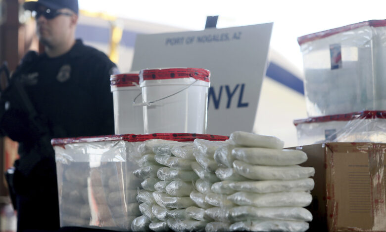 Packets of fentanyl mostly in powder form and methamphetamine which U.S. Customs and Border Protection seized scaled