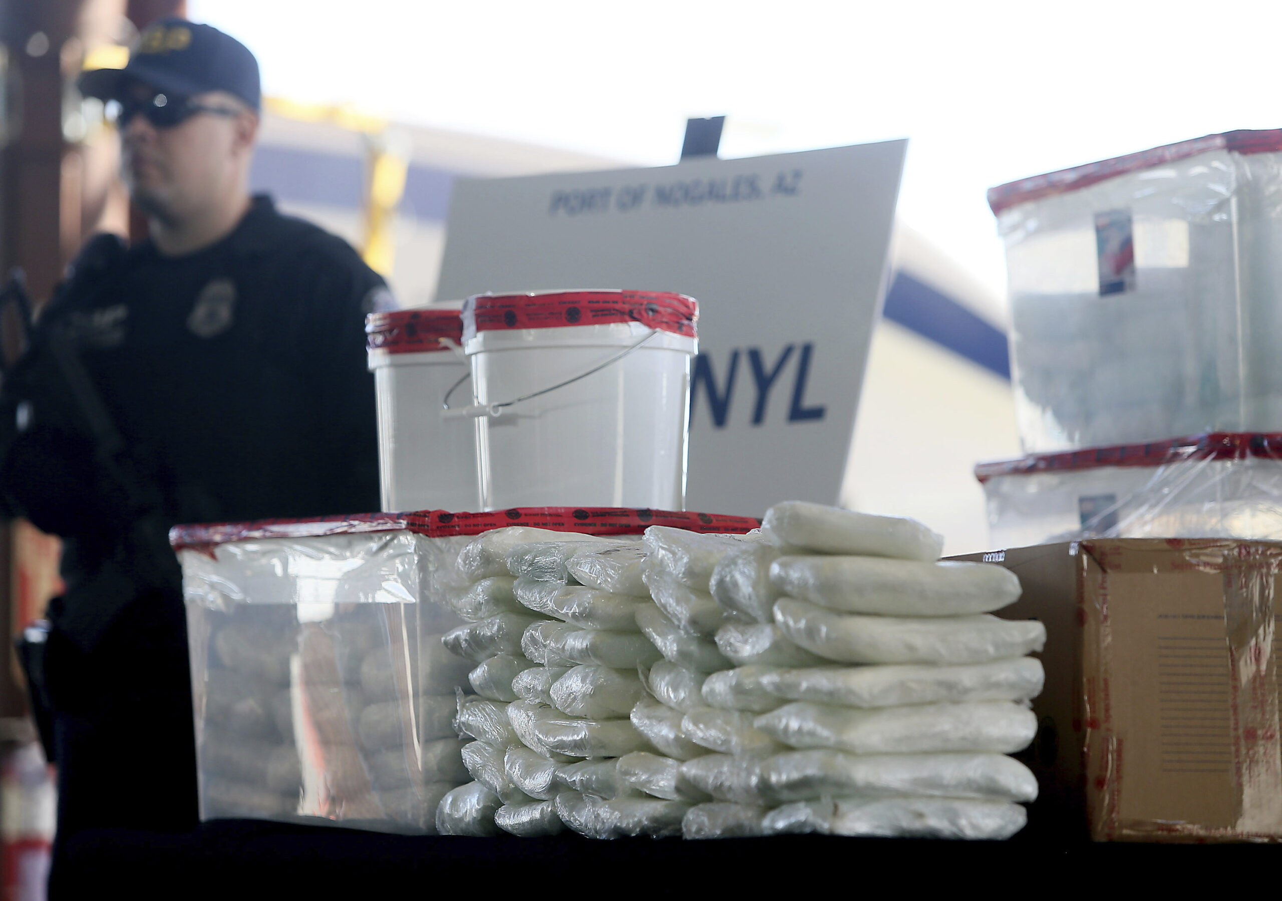 Packets of fentanyl mostly in powder form and methamphetamine which U.S. Customs and Border Protection seized scaled