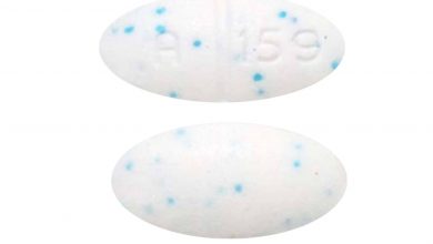 White A 159 Pill With Blue Specs