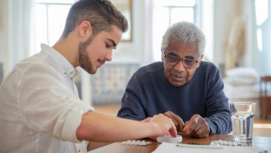 Two men preparing medicine dosages and preventing opioid misuse